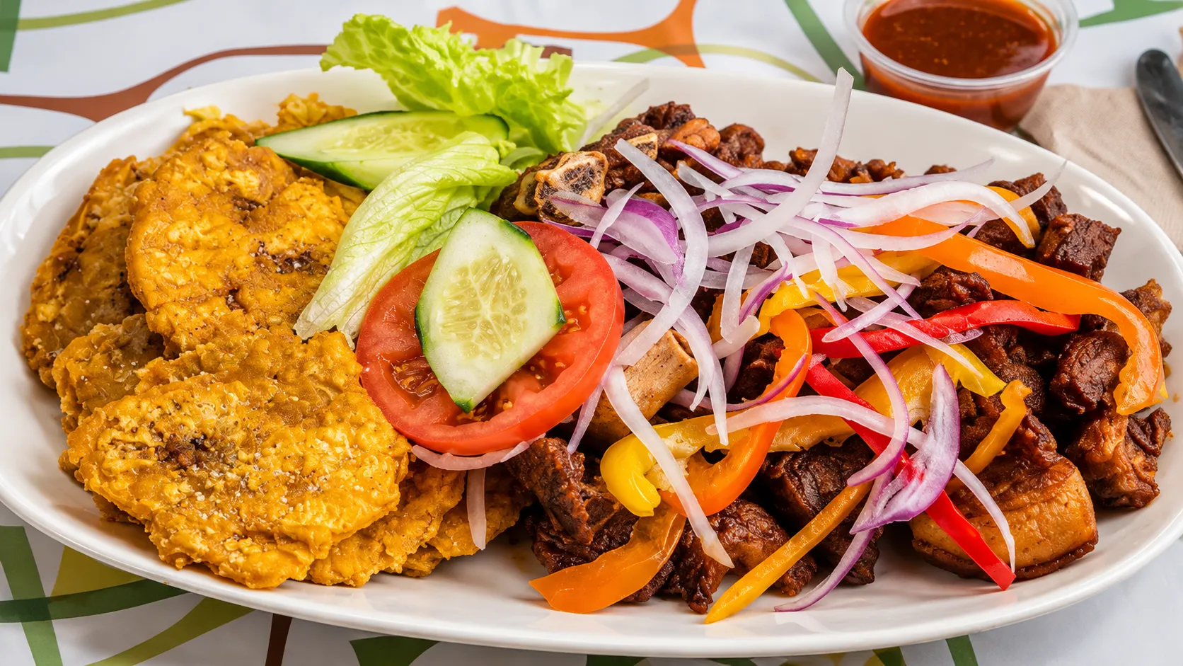Haitian fritay with fried plantain, fried cassava and fried meat at Caribbean Latino Finger Licking Restaurant Edmonton